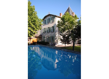 The swimmimg pool and the building: a former priory