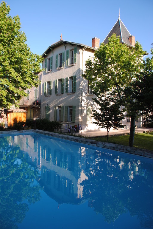 The swimmimg pool and the building: a former priory