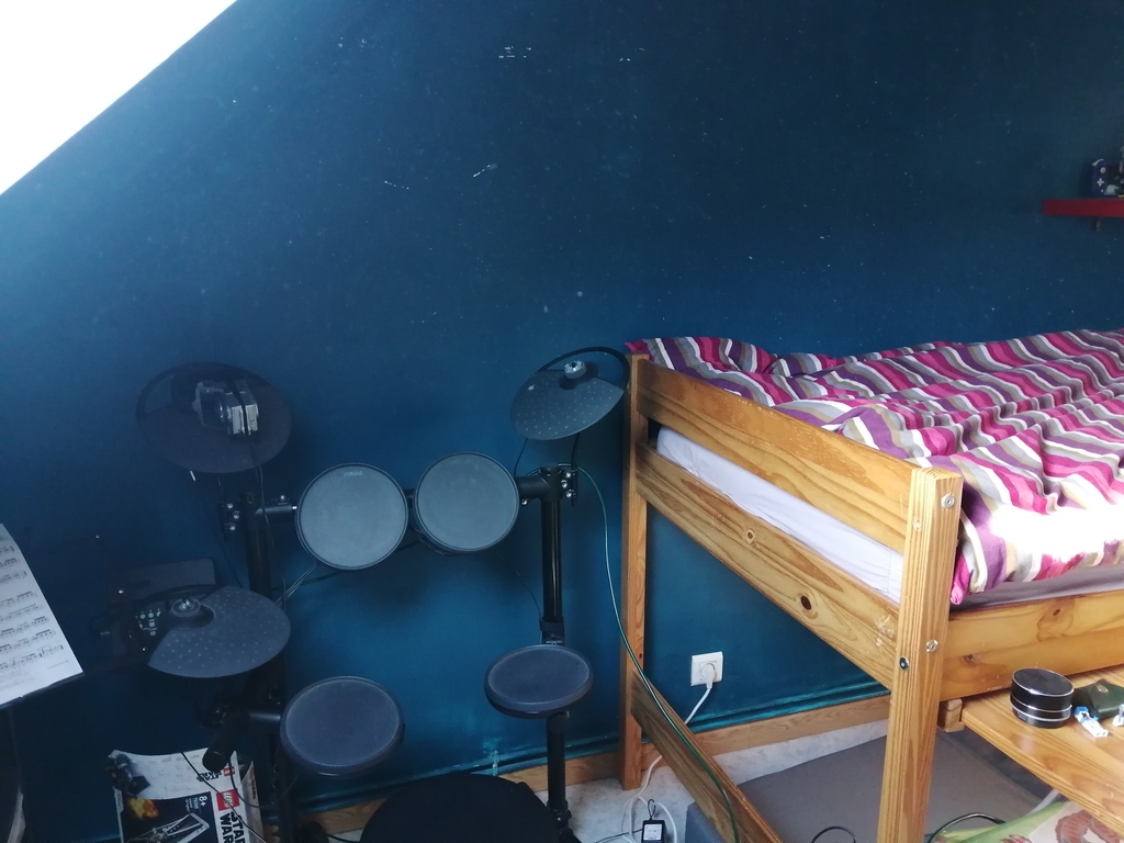 our son's bedroom with electric drum