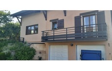 Entrance with automatic gate and garage doors and space to park.