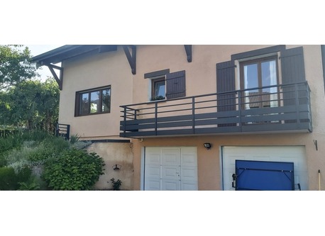 Entrance with automatic gate and garage doors and space to park.