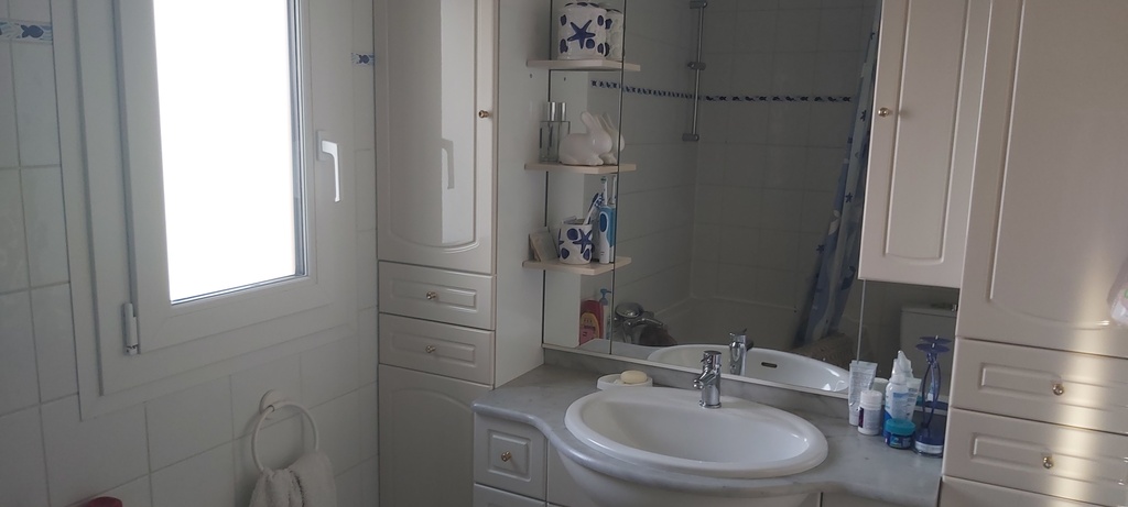 Upstairs bathroom with toilet and bath. There is also a toilet downstairs. 3 in all.