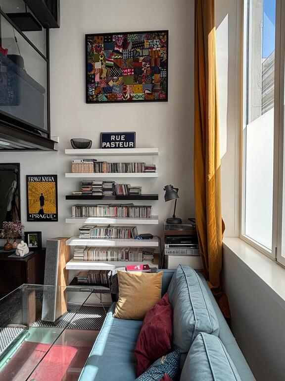 Living room with large window and mezzanine 