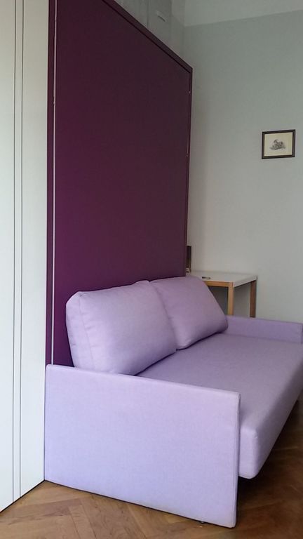 Bedroom with retractable bed