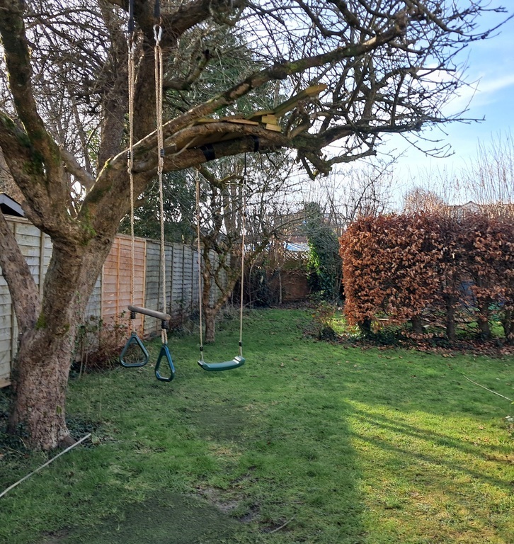 Garden with swing, trapeze and treehouse