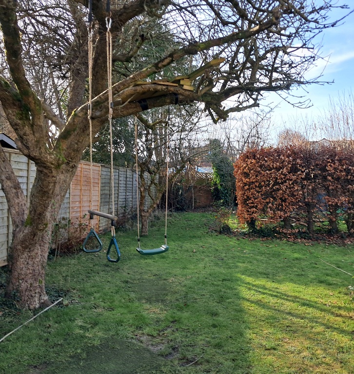 Garden with swing, trapeze and treehouse