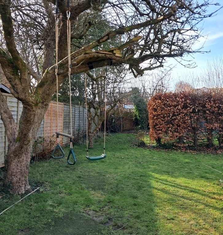 Garden with swing, trapeze and treehouse
