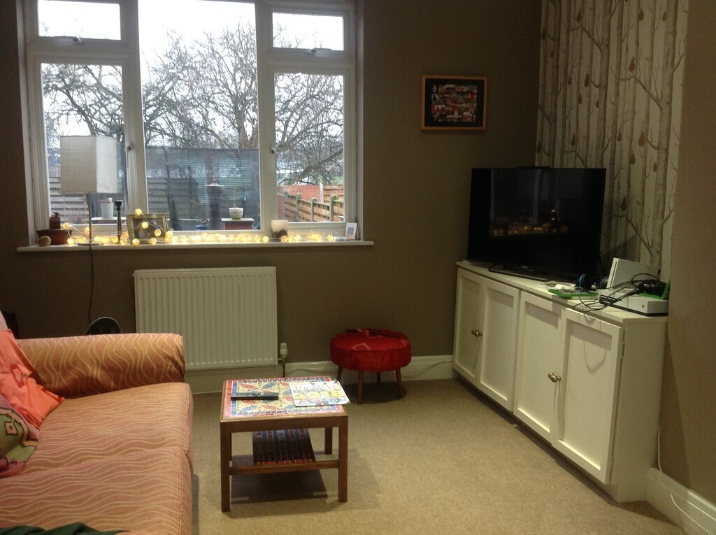 TV lounge with a view onto the garden