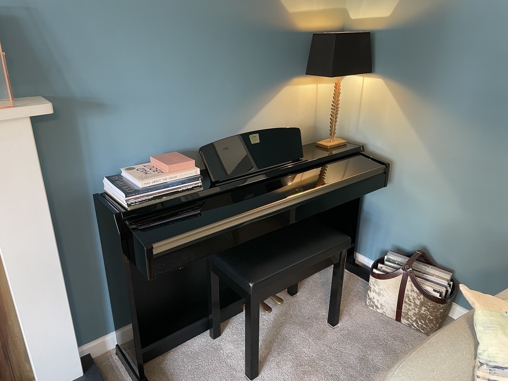 Clavinova (electric piano) in the sitting room, with lots of sheet music to enjoy!