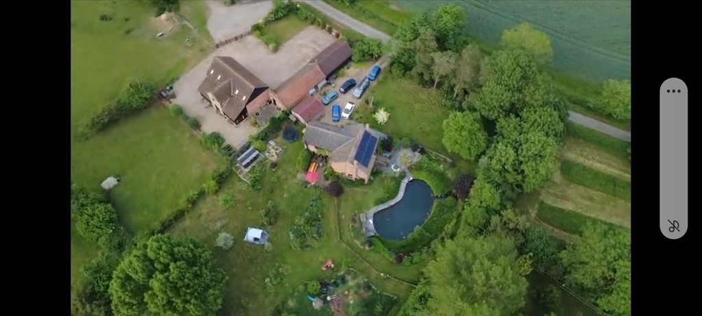 Drone shot of our house and next door. Lots of parking.