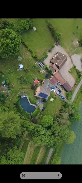 Drone shot of our house and next door. Lots of parking.