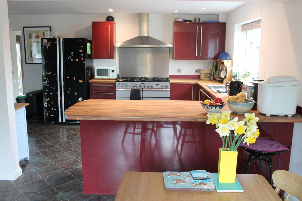 kitchen with large fridge & range cooker