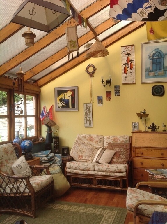 We tend to live in our Sunroom, it is bright and cheery! 