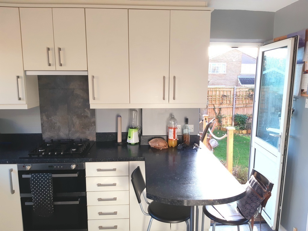 Kitchen and door out to decking/garden.