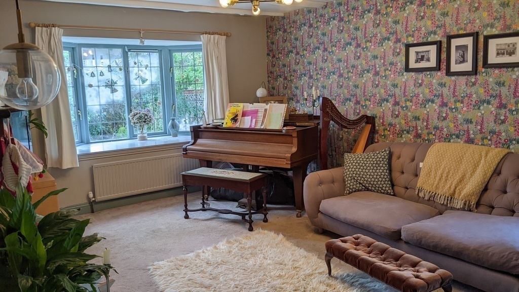 Sitting room with piano and harp!