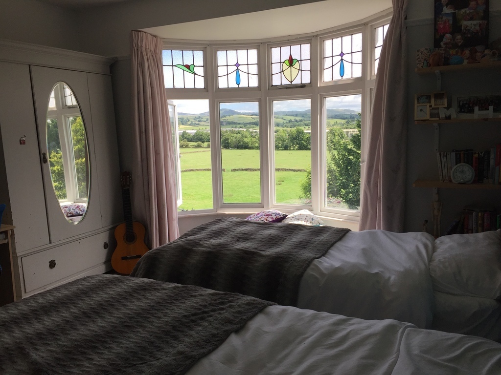 Upstairs bedroom with two single beds 