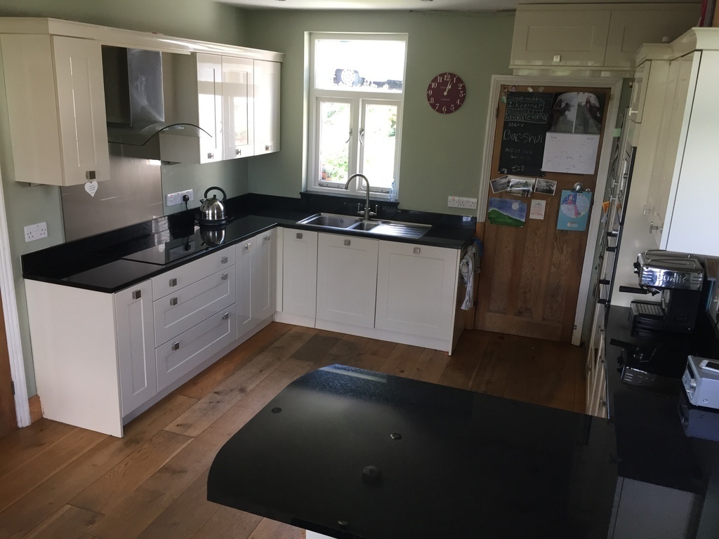 Kitchen and breakfast bar (including oven, microwave, fridge/freezer, coffee machine) 
