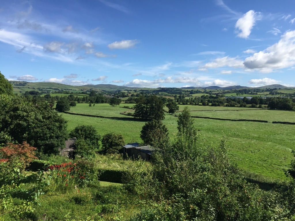 View from the back garden across fields to the River Kent and towards the Dales 