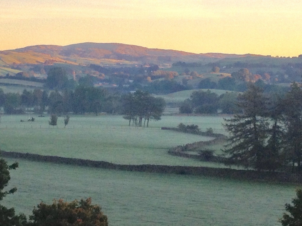 outside space at the back of the house overlooking the fields, hills and river