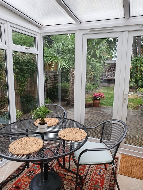 Rear sunroom and casual summer dining area