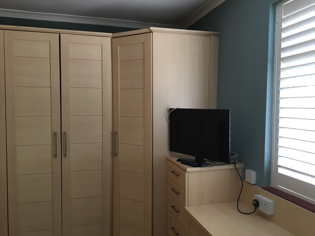 Main bedroom.  Plenty of storage.  TV.