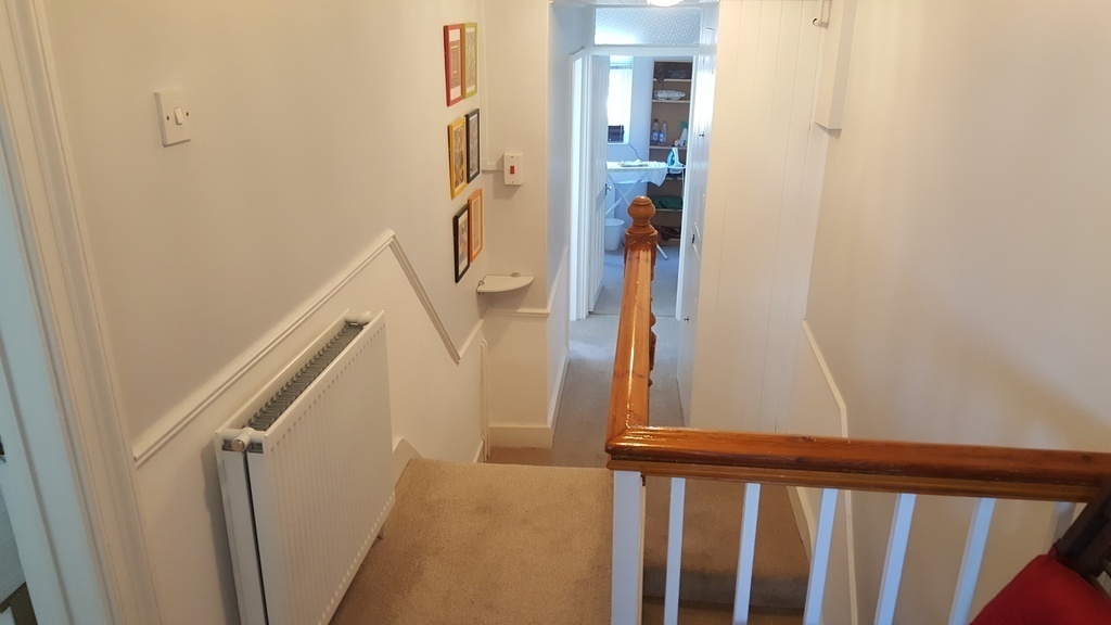 Stairs and landing to the two top bedrooms