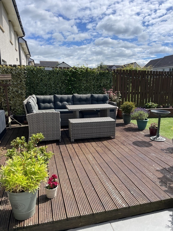 Decking with sofa and dining table