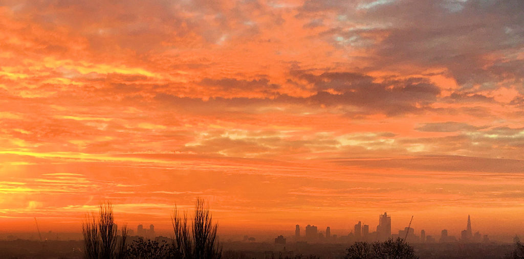 Sunrise over the city from the back of the house