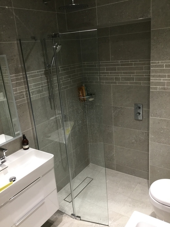 Walk-in shower in bathroom.