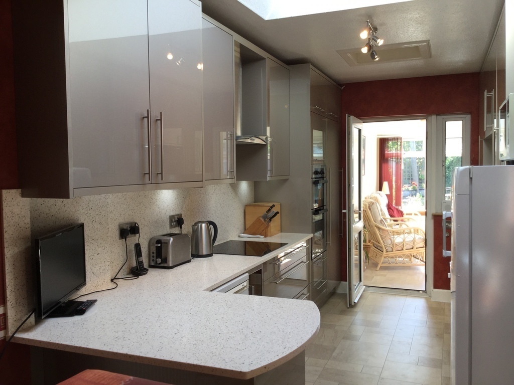 Modern kitchen, looking towards garden room