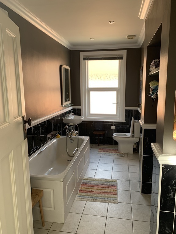 Family bathroom, shower (behind door)  and separate bath