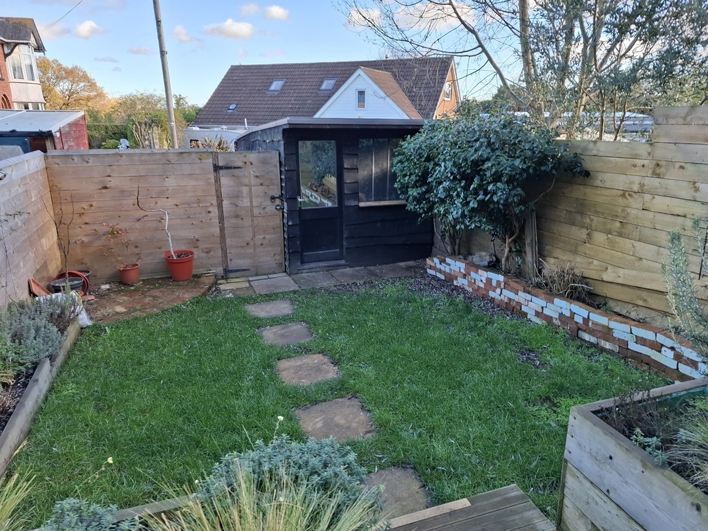 Garden and door to parking space