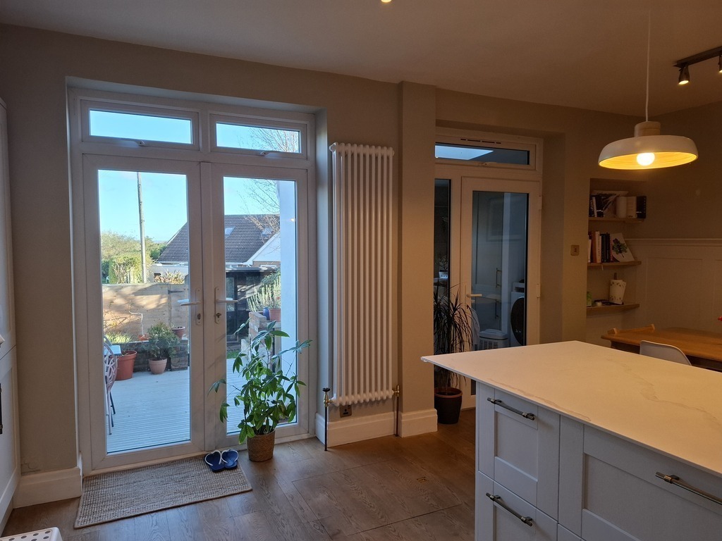 Kitchen and French doors onto deck and garden