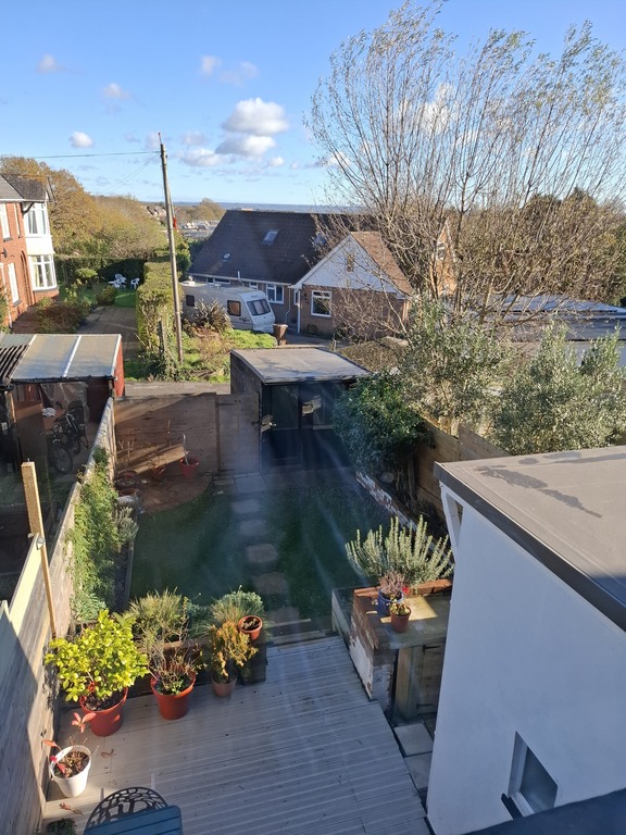 View of deck and garden from second bedroom