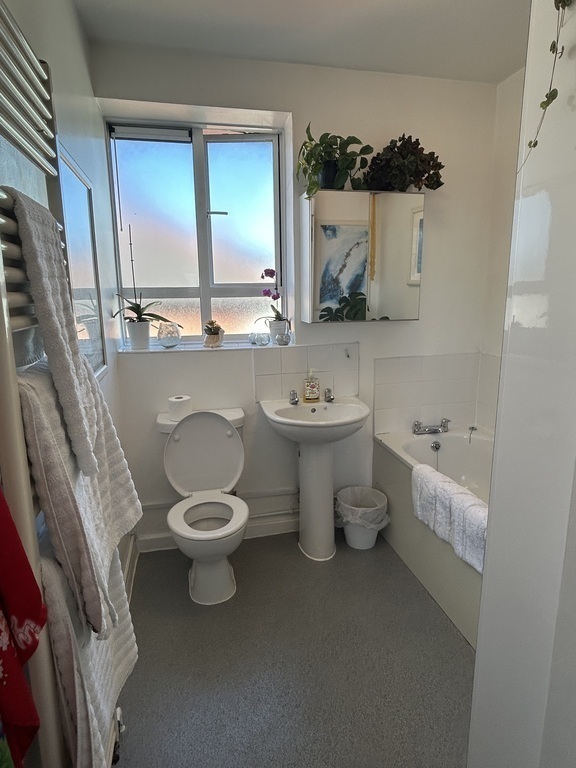 Our bathroom with bathtub. We do not have a shower