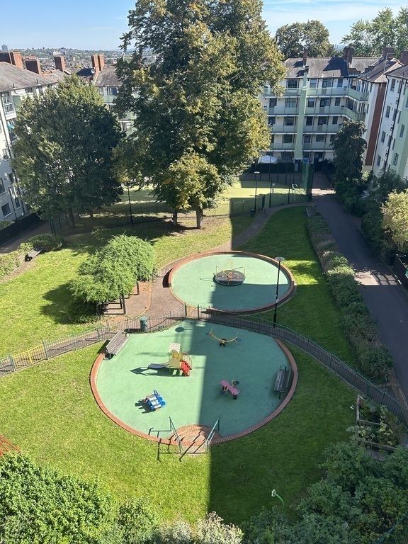 Courtyard downstairs with playground and football pitch