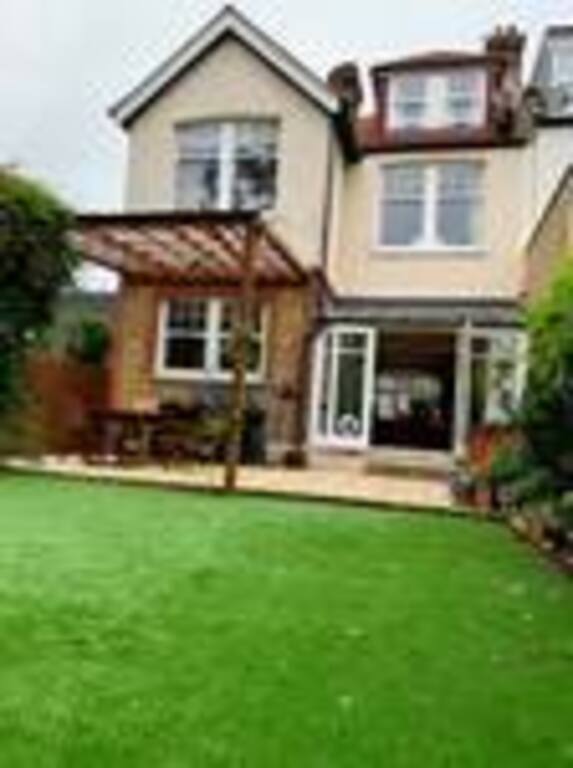 view of house and patio from back garden