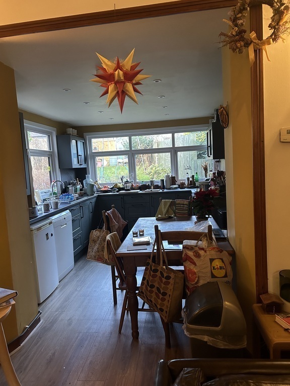 Back sitting room leading to kitchen looking out to back garden