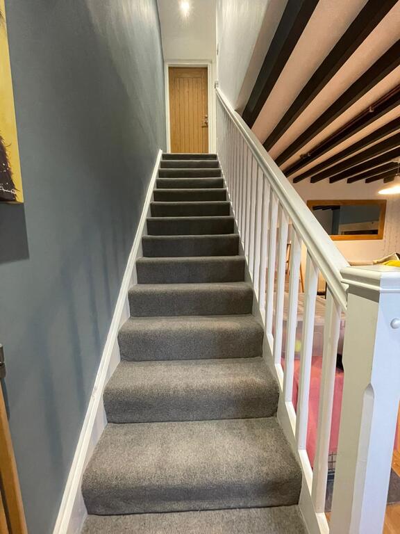 Stairs with baby gate at the bottom of the stairs ( no baby gate at the top of the stairs)