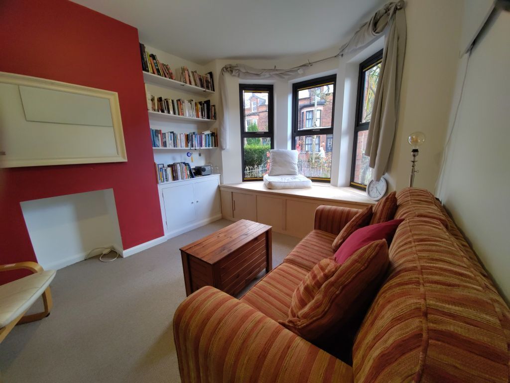 Living room with toys hidden away under the window seat