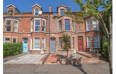 Our house is the one with the grey door