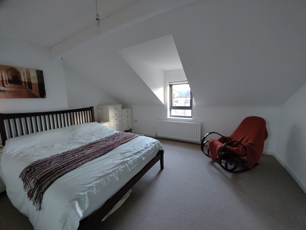 Top floor double bedroom with antique rocking chair