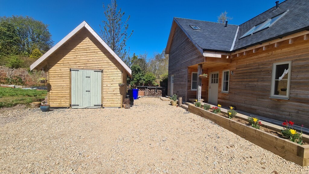 Parking area, with main entrance and shed