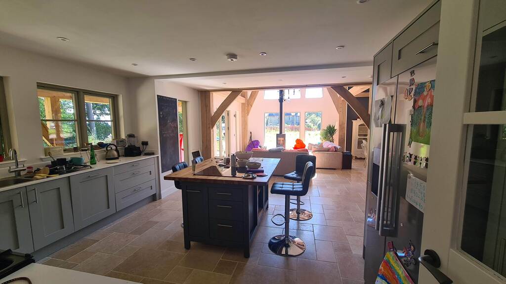 Open plan kitchen with range cooker and induction stove