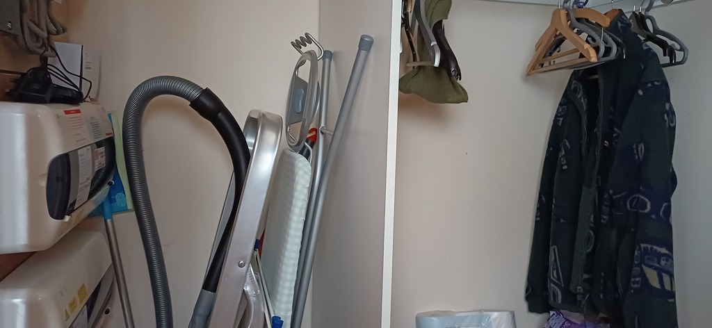 Hall cupboard with hanging rail. Cleaning and materials and vacuum available. 