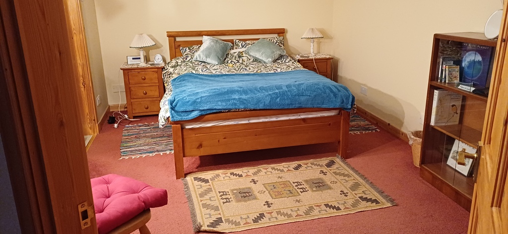 Large double bedroom with ensuite shower. Large built in cupboard and wardrobe. 