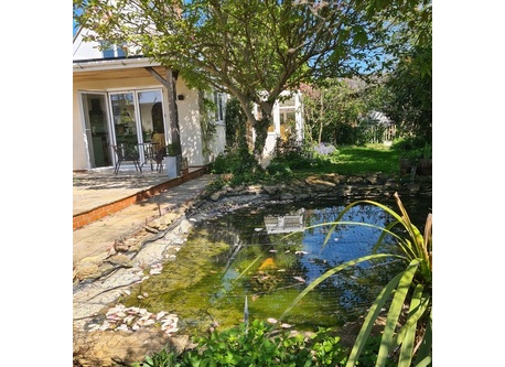 View from the side of the pond to the kitchen verandah