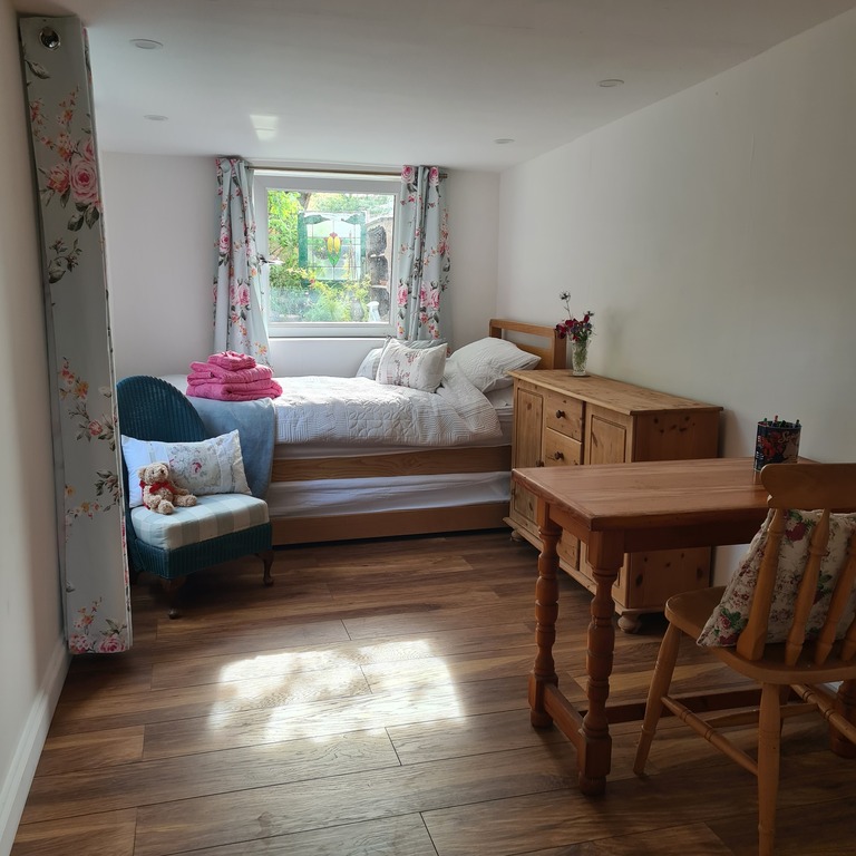 The Garden Room; the new double guest room with private access to the drive with available parking.