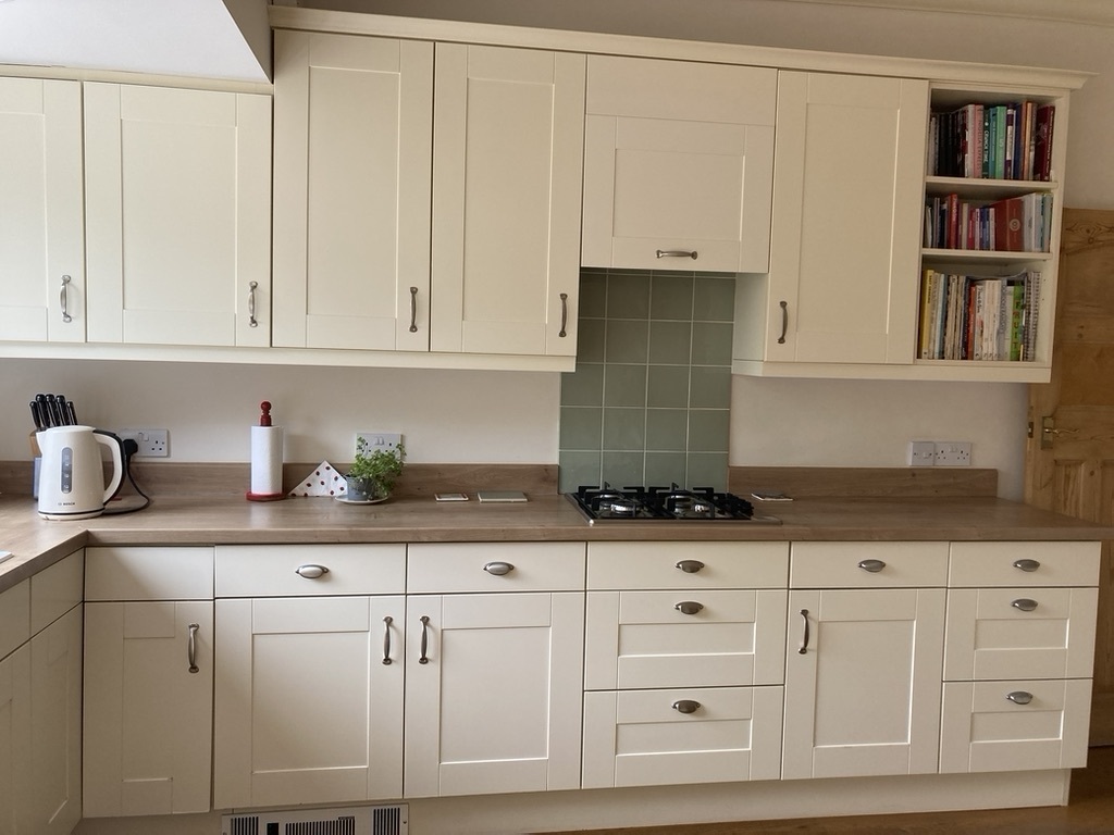One side of kitchen - there is a double oven and more cupboards opposite