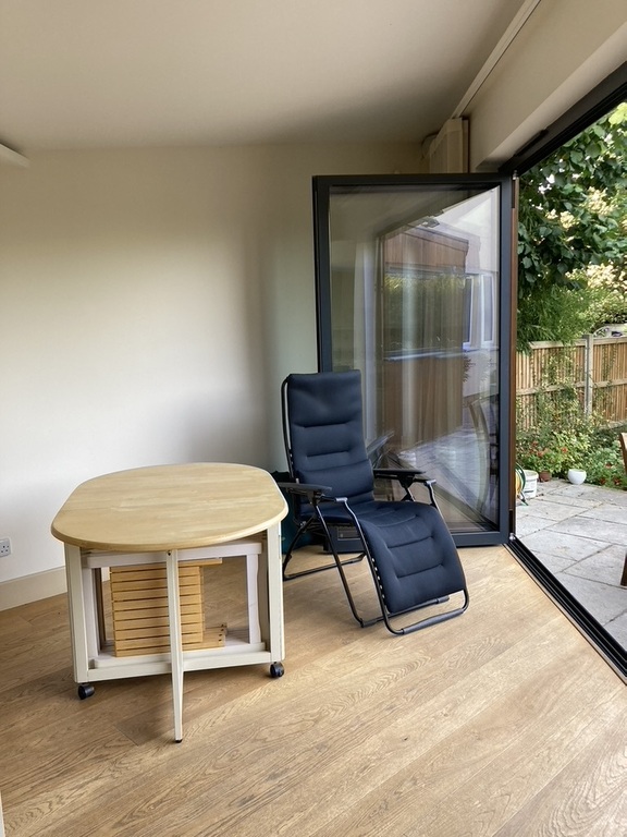 The 'Garden Room' off the kitchen with patio